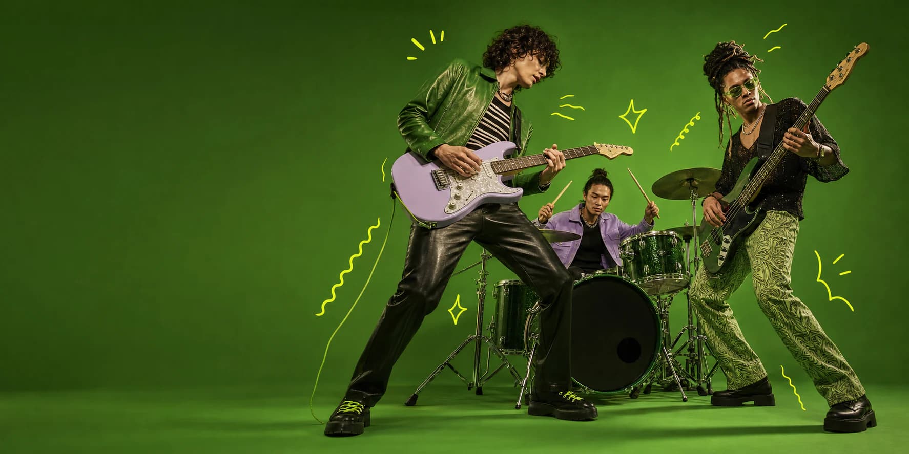 Musicians performing in a green studio